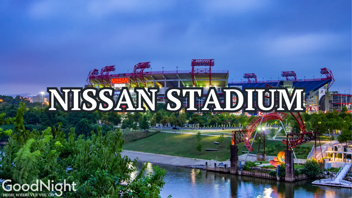 This image features Nissan Stadium with its recognizable structure, parkland surrounding the stadium, the river, walking paths, and outdoor sculptures. The space is vibrant and lively, with a clear focus on both recreation and city life.